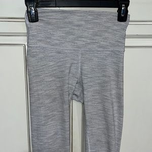 Lululemon leggings size 4 minor piling.. minor purple dot on back as shown